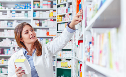 Photo,of,a,professional,pharmacist,checking,stock,in,an,aisle